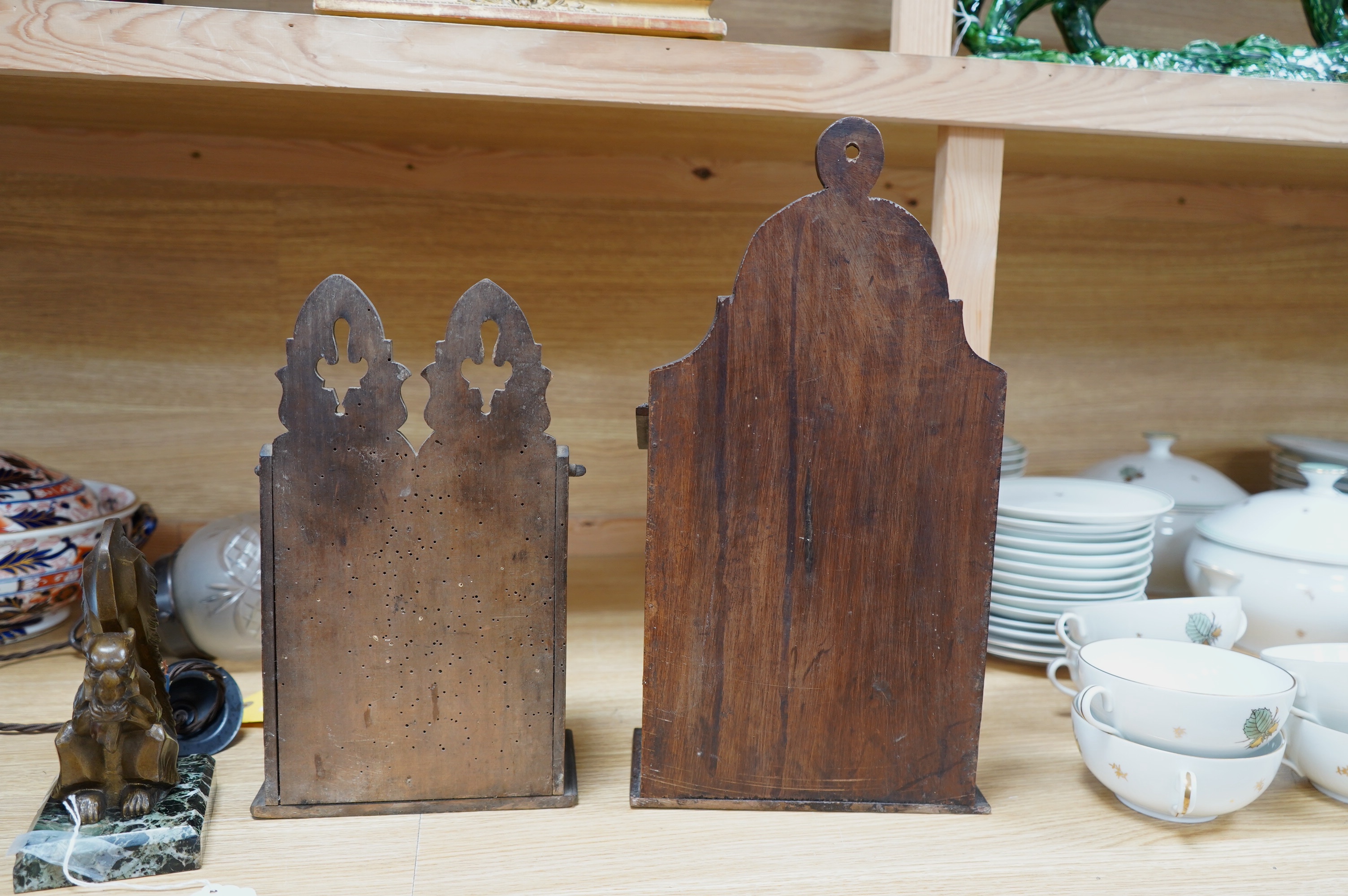 Two 19th century carved beech salt boxes, largest 40cm high. Condition - fair